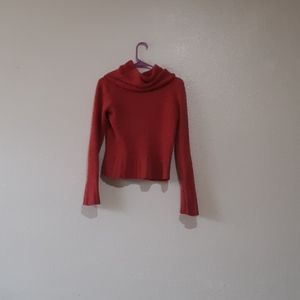 Long sleeve red turtleneck shirt.